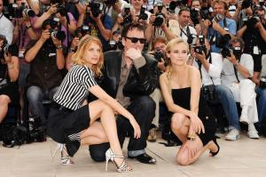 Actress Melanie Laurent with director Quentin Tarantino and Diane Kruger, wearing a Jaeger-LeCoultre reverso squadra lady in pink gold attend the Inglourious Basterds Photocall held at the Palais Des Festivals during the 62nd International Cannes Film Festival on May 20, 2009 in Cannes, France. (Photo by Pascal Le Segretain/Getty Images)