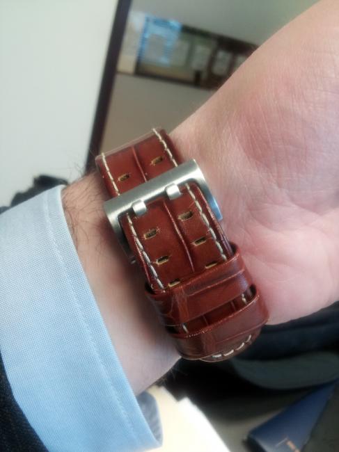 brown leather strap and stainless steel buckle