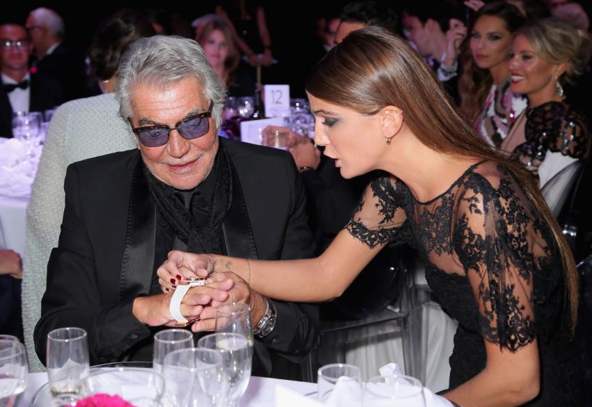 The winning bidder, designer Roberto Cavalli with Bianca Brandolini d’Adda