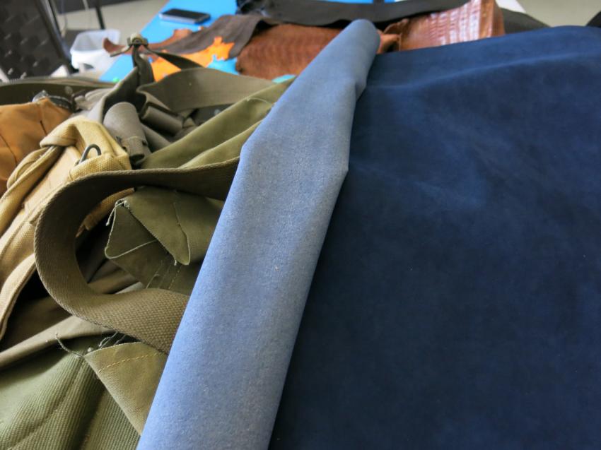 On top a vintage military canvas, the blue material is Alcantara, usually used for the interiors of luxury cars, such as the Lamborghini.