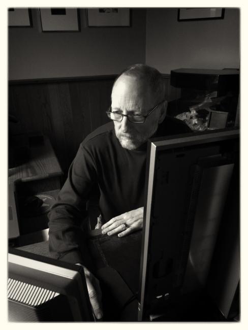 W Paul Rayner in front of his computer. Photo by PJ Rayner.