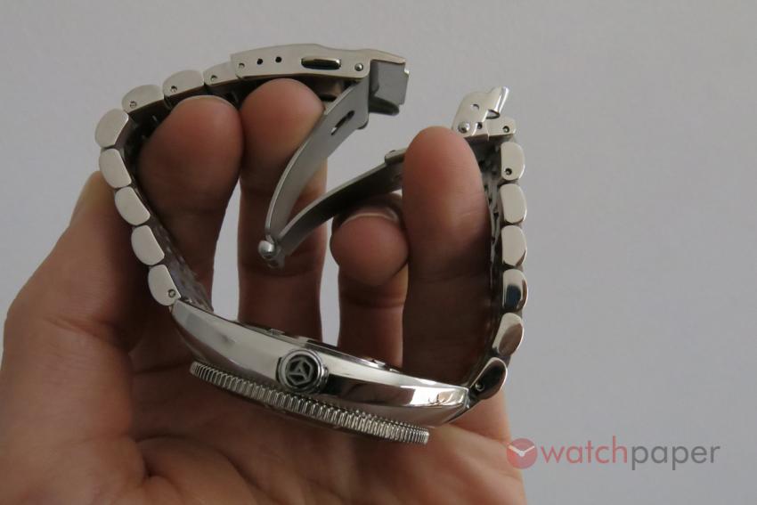 A side-view of the bracelet showing the micro-adjustment holes of the clasp.