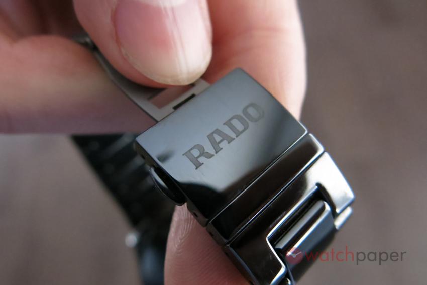 The ceramic cover is engraved with the Rado logo.