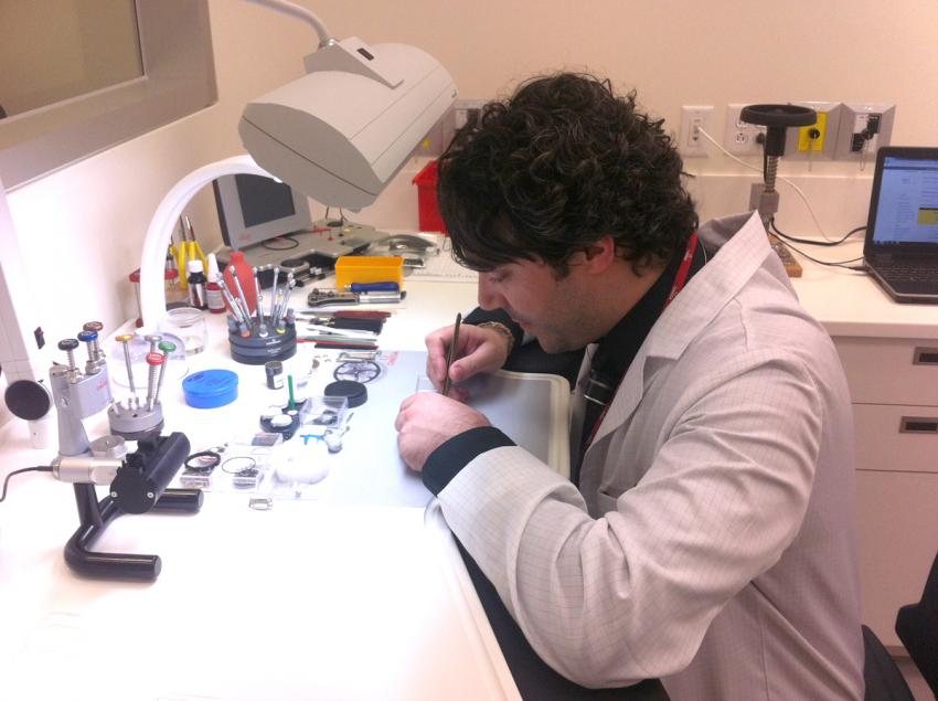 Watchmaker working at the Swatch Group Service Center in Montreal