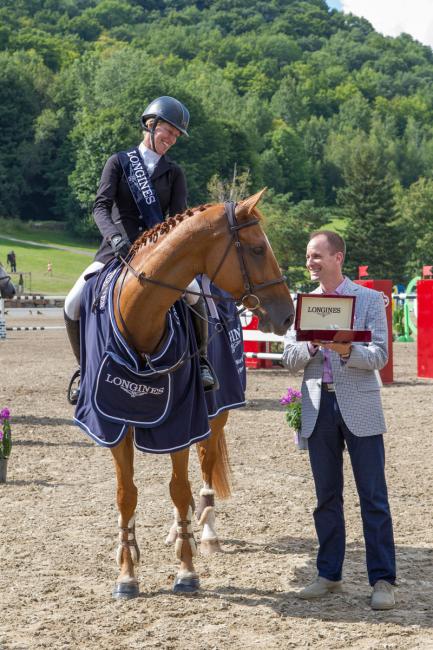 Ian Charbonneau, Longines Brand Manager Canada. Schulyer Riley, Dobra de Porceyo, winners of The Longines FEI World Cup - North American League, Bromont, Canada