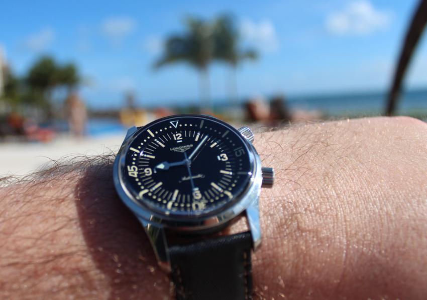 Blue sky, white sandy beach and a Longines Legend Diver.