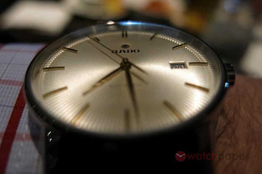 Rado Coupole Classic in the dim light of the steakhouse