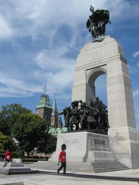 Ceremonial guards march by the Tomb of the Unknown Soldier at the National War Memorial in Ottawa, Canada.